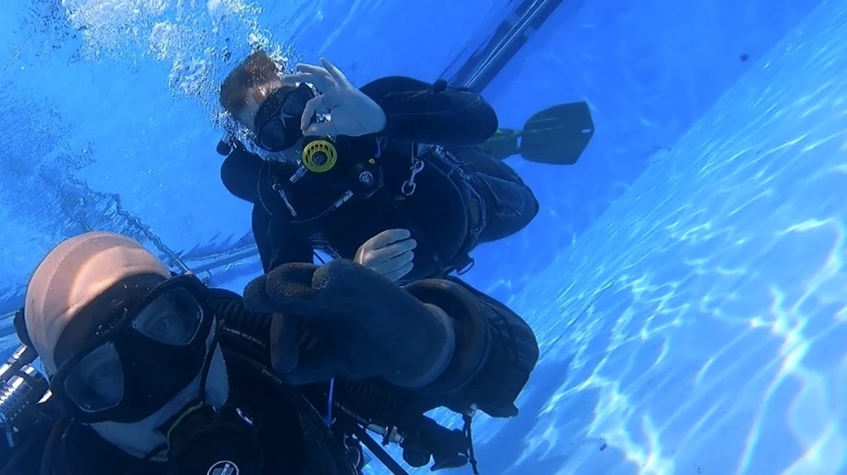 Try diving in the pool at DiveWithSteini: giving the OK signal underwater